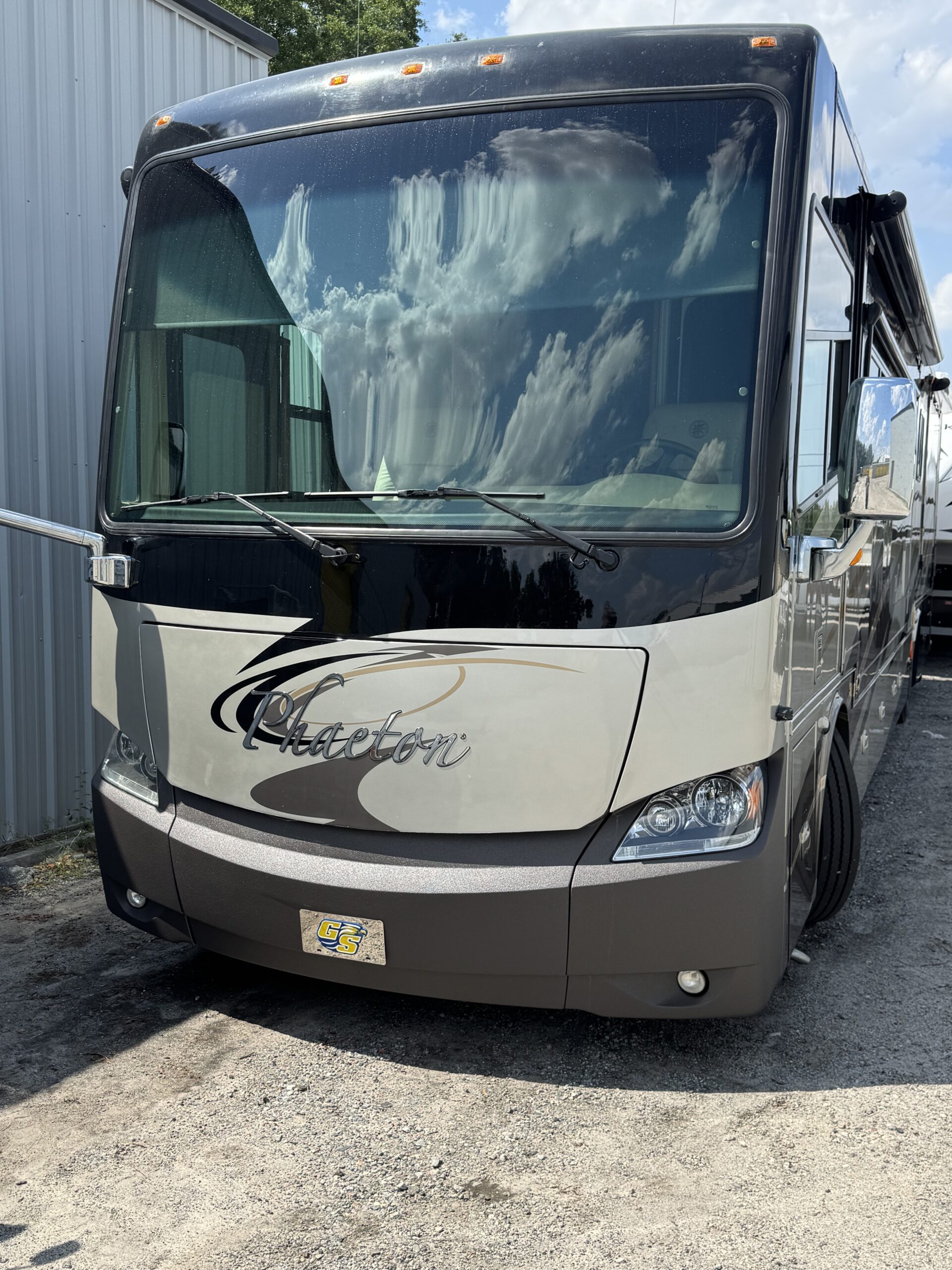 Refinished RV front bumper with smooth, color-matched coating replacing damaged Diamond Shield.